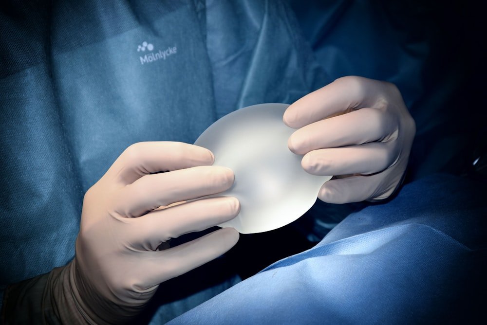Surgeon sterile gloved hands during a procedure at Kapadia Hospital, Mumbai